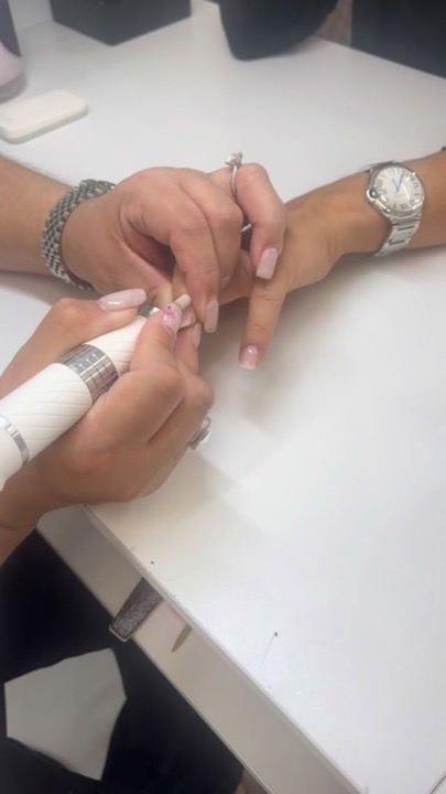 Manicure in progress at the nail station